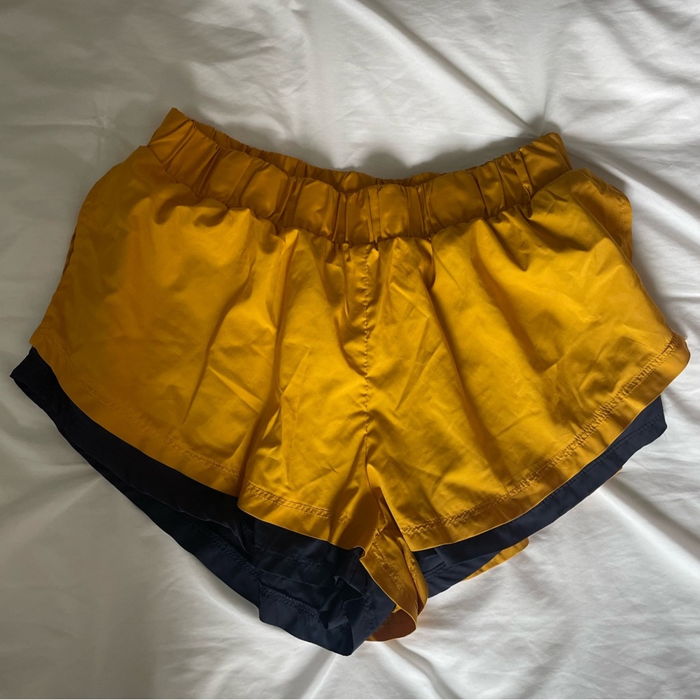Free people movement shorts yellow and blue